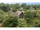 Aerial view of a home nestled in a tree-filled landscape at 1515 Heatherloch Dr, Gastonia, NC 28054