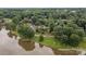 Aerial view of a scenic estate with tree coverage and pond views at 1515 Heatherloch Dr, Gastonia, NC 28054