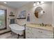 Bright bathroom with a clawfoot tub, granite vanity, and an elegant, traditional design at 1515 Heatherloch Dr, Gastonia, NC 28054