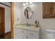 Bathroom features granite-topped vanity with sink and a well-lit mirror at 1515 Heatherloch Dr, Gastonia, NC 28054