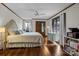 Spacious bedroom with hardwood floors, large windows, ceiling fan, and stylish decor at 1515 Heatherloch Dr, Gastonia, NC 28054