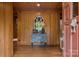 Cozy foyer featuring wood paneling, a decorative table, and an arched window, creating a warm welcome at 1515 Heatherloch Dr, Gastonia, NC 28054