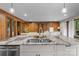 Spacious kitchen island with granite countertops, stainless steel sink, and ample cabinet space at 1515 Heatherloch Dr, Gastonia, NC 28054