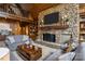 Charming living room with stone fireplace, vaulted ceilings, and comfortable seating at 1515 Heatherloch Dr, Gastonia, NC 28054