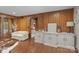 Cozy living room features wood paneling, hardwood floors, and stylish decor at 1515 Heatherloch Dr, Gastonia, NC 28054