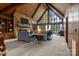 Grand living room with stone fireplace, vaulted ceilings, and walls of windows at 1515 Heatherloch Dr, Gastonia, NC 28054