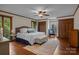Spacious main bedroom with hardwood floors, ceiling fan, and ensuite bathroom at 1515 Heatherloch Dr, Gastonia, NC 28054