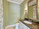 Powder room with granite countertop, decorative mirror, and neutral decor at 1522 High St, Charlotte, NC 28211
