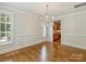 Elegant dining room with hardwood floors, large windows, and chandelier at 1522 High St, Charlotte, NC 28211