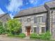 Charming stone townhome featuring beautiful landscaping and a private entrance at 1522 High St, Charlotte, NC 28211