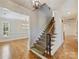Elegant foyer with hardwood floors, grand staircase, and stylish chandelier at 1522 High St, Charlotte, NC 28211