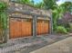 Spacious detached two-car garage featuring two wooden doors and ample parking at 1522 High St, Charlotte, NC 28211