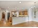 Open-concept kitchen featuring stainless steel appliances, wood cabinets and a spacious island at 1522 High St, Charlotte, NC 28211