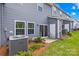 Backyard patio space with sliding door and seating with blue siding at 1563 Old Rivers Rd, Concord, NC 28027