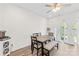 Bright dining area with wood-look floors and access to outdoor space through patio doors at 1563 Old Rivers Rd, Concord, NC 28027