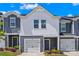 Charming townhome featuring a one car garage and landscaped front yard, perfect for a modern living experience at 1563 Old Rivers Rd, Concord, NC 28027