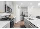 Contemporary kitchen with stainless steel appliances and a white countertop at 1563 Old Rivers Rd, Concord, NC 28027