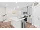 Bright kitchen featuring stainless steel appliances, island and light fixtures at 1563 Old Rivers Rd, Concord, NC 28027