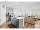 Open-concept kitchen with a center island and stainless steel appliances at 1563 Old Rivers Rd, Concord, NC 28027