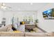 Spacious living room featuring large sectional sofa, tv, and natural lighting at 1563 Old Rivers Rd, Concord, NC 28027
