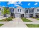 Charming townhome with a garage and a well-manicured front yard at 1563 Old Rivers Rd, Concord, NC 28027