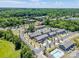 Aerial view of a townhome community featuring mature trees and convenient access to roads at 16039 Simril Ct, Charlotte, NC 28278