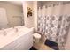 Standard bathroom featuring a shower with designed curtain and a single sink vanity at 16039 Simril Ct, Charlotte, NC 28278