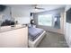 Modern bedroom with a sleek design and large windows provides ample natural light at 16039 Simril Ct, Charlotte, NC 28278