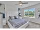 Bright bedroom with a ceiling fan, large window, and neutral décor at 16039 Simril Ct, Charlotte, NC 28278