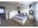 Spacious primary bedroom suite with contemporary decor, neutral colors, and plenty of natural light at 16039 Simril Ct, Charlotte, NC 28278