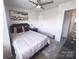 Comfortable bedroom with neutral tones, contemporary decor, and ample natural light at 16039 Simril Ct, Charlotte, NC 28278