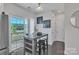 View of the dining area leading to a balcony overlooking a scenic view at 16039 Simril Ct, Charlotte, NC 28278