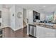 Modern kitchen featuring stainless steel appliances, granite countertops, and an open floor plan at 16039 Simril Ct, Charlotte, NC 28278
