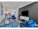Stylish living room with a modern accent wall and sleek furniture, offering a comfortable living space at 16039 Simril Ct, Charlotte, NC 28278