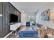 Comfortable living room with modern decor, a statement wall, and natural light throughout at 16039 Simril Ct, Charlotte, NC 28278