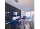 Contemporary living room featuring a black accent wall, plush seating, and modern decor for a sophisticated style at 16039 Simril Ct, Charlotte, NC 28278