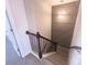 Stylish staircase featuring decorative wall paneling and modern lighting fixture at 16039 Simril Ct, Charlotte, NC 28278