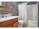 Cozy bathroom featuring a shower-tub combo, stylish vanity and decorative accents at 1609 Mcfarland Dr, Shelby, NC 28152
