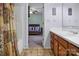 Bright bathroom view leading to a bedroom featuring a single vanity with a bright mirror at 1609 Mcfarland Dr, Shelby, NC 28152