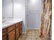 Cozy bathroom featuring a single vanity with a bright mirror and a shower with stylish curtain at 1609 Mcfarland Dr, Shelby, NC 28152