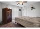 Bedroom featuring a bed frame, carpet flooring, ceiling fan, and a safe box at 1609 Mcfarland Dr, Shelby, NC 28152