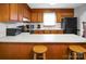 Bright kitchen with modern appliances, ample counter space, and comfortable breakfast bar seating at 1609 Mcfarland Dr, Shelby, NC 28152