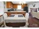 Eat-in kitchen with a breakfast bar open to the living room at 1609 Mcfarland Dr, Shelby, NC 28152