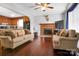 Inviting living room featuring hardwood floors, a fireplace, and comfortable seating area at 1609 Mcfarland Dr, Shelby, NC 28152