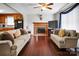 Inviting living room featuring hardwood floors, a fireplace, and comfortable seating area at 1609 Mcfarland Dr, Shelby, NC 28152