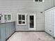 Backyard featuring gray wood siding, a door to the house, and a fenced in area at 1908 Harvest Ln # 5, Charlotte, NC 28210