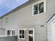 Back exterior featuring light gray wood siding and fenced in backyard at 1908 Harvest Ln # 5, Charlotte, NC 28210