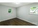 This bedroom has refinished hardwood floors, fresh paint and two windows providing lots of natural light at 1936 Russell Ave, Charlotte, NC 28216