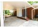 Covered carport with brick accents offers protected parking and convenient access to the home's entrance at 1936 Russell Ave, Charlotte, NC 28216