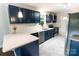 Stylish kitchen featuring blue cabinets, quartz countertops, stainless appliances, and modern finishes at 1936 Russell Ave, Charlotte, NC 28216